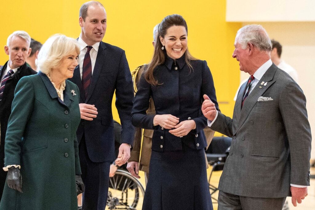 Britain's Prince William, Duke of Cambridge and his wife Britain's Catherine, Duchess of Cambridge talk with his father Britain's Prince Charles, Prince of Wales and his wife Britain's Camilla, Duchess of Cornwall during their visit to the Defence Medical Rehabilitation Centre (DMRC) in Loughborough, central England on February 11, 2020.  