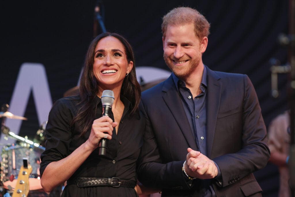 Prince Harry, Duke of Sussex and Meghan, Duchess of Sussex speak on stage at the "Friends @ Home Event" at the Station Airport during day three of the Invictus Games DÃ¼sseldorf 2023 on September 12, 2023 in Duesseldorf, Germany.