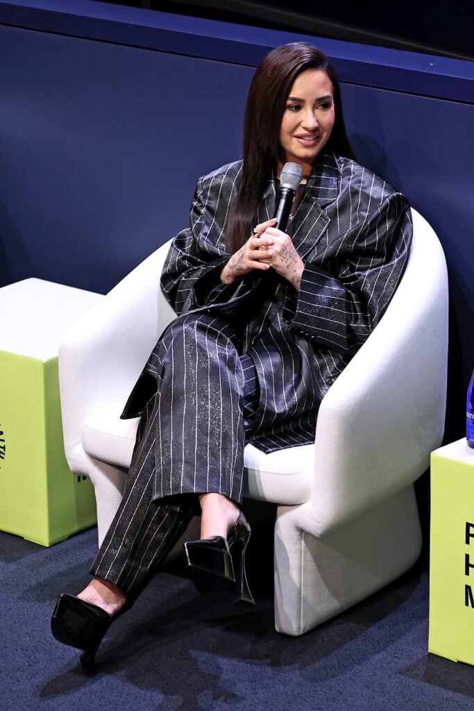 Demi Lovato speaks onstage during the Project Healthy Minds World Mental Health Day Festival at Hudson Yards on October 10, 2024 in New York City.  