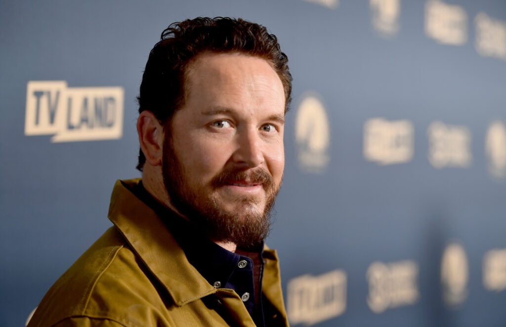 Cole Hauser on May 30, 2019 while wearing a mustard yellow jacket.