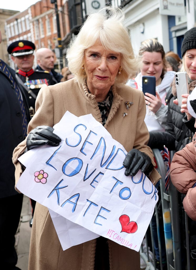 Queen Camilla holds a get-well message intended for her daughter-in-law.