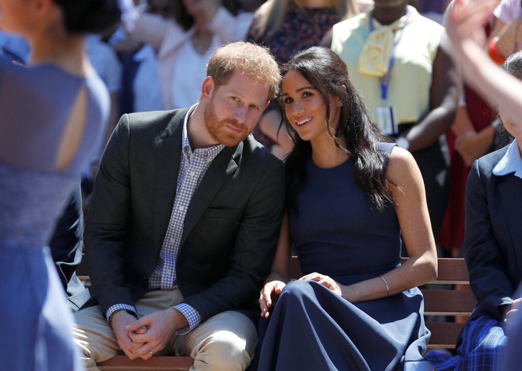 Prince Harry, Duke of Sussex and Meghan, Duchess of Sussex watch a performance during their visit to Macarthur Girls High School on October 19, 2018 in Sydney, Australia.