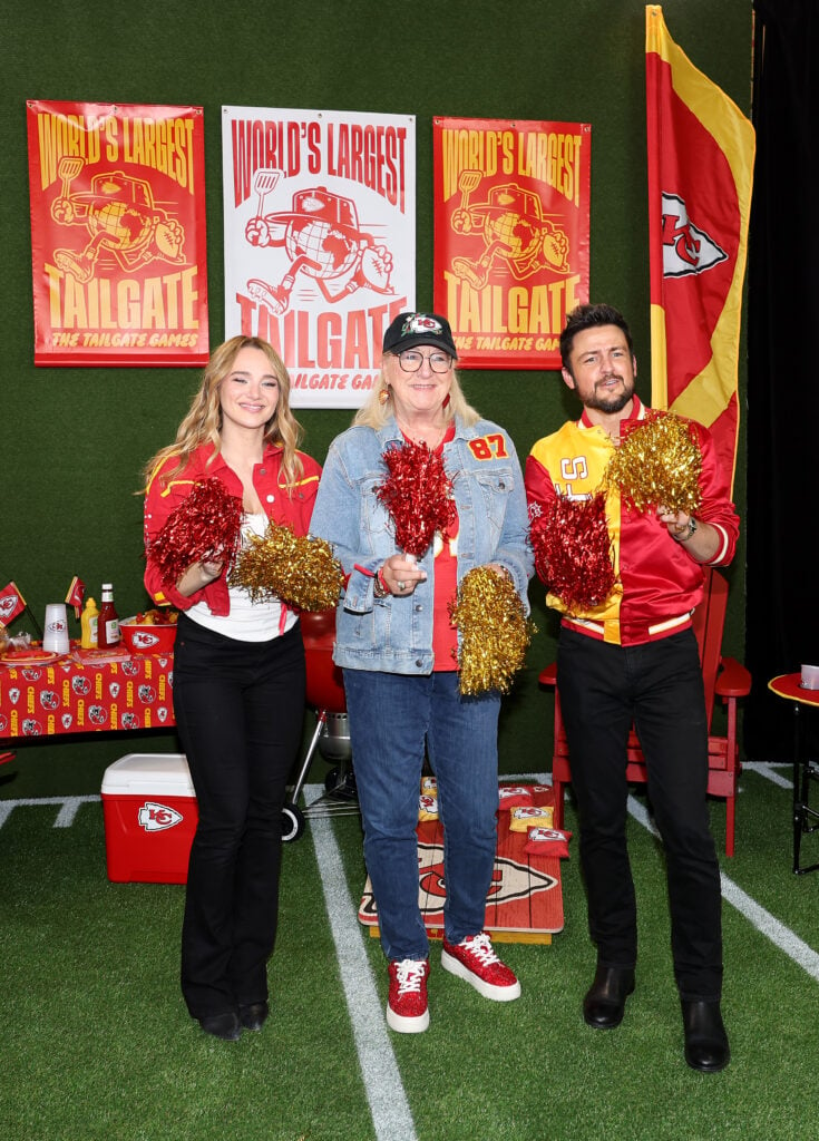 Hunter King, Donna Kelce and Tyler Hynes attend the red carpet at the "World's Largest Tailgate" ahead of the Baltimore Ravens v Kansas City Chiefs game at GEHA Field at Arrowhead Stadium on September 05, 2024 in Kansas City, Missouri. 