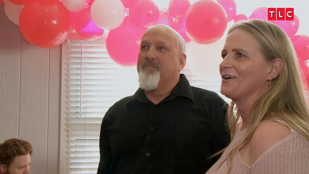 David Woolley and Christine Brown on Sister Wives with pink balloons.