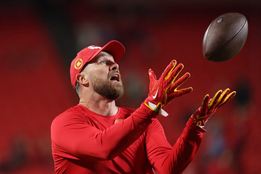 Travis Kelce catches a sports ball on December 8, 2024.