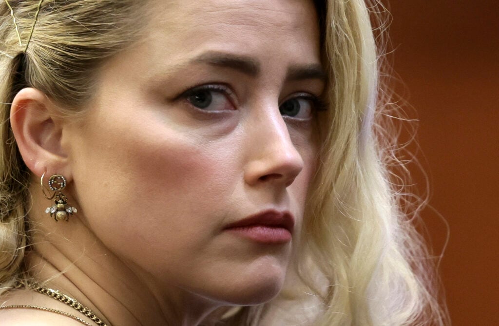 US actress Amber Heard waits before the jury announced a split verdict in favor of both Johnny Depp and Amber Heard on their claim and counter-claim in the Depp v. Heard civil defamation trial at the Fairfax County Circuit Courthouse in Fairfax, Virginia, on June 1, 2022.  