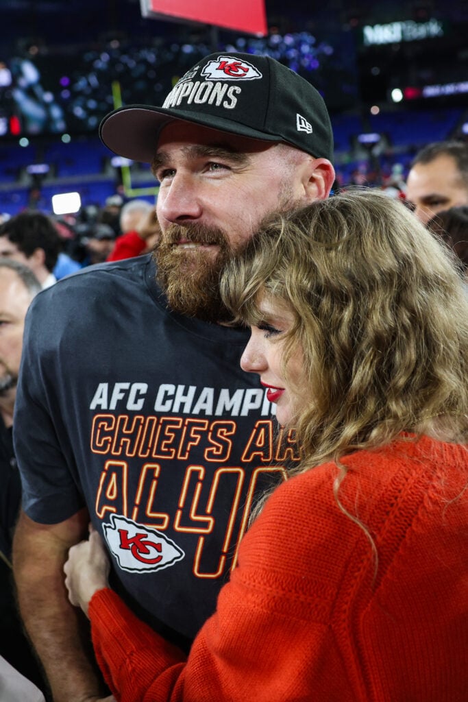 ]Travis Kelce #87 of the Kansas City Chiefs celebrates with Taylor Swift after defeating the Baltimore Ravens in the AFC Championship Game at M&T Bank Stadium on January 28, 2024 in Baltimore, Maryland. 