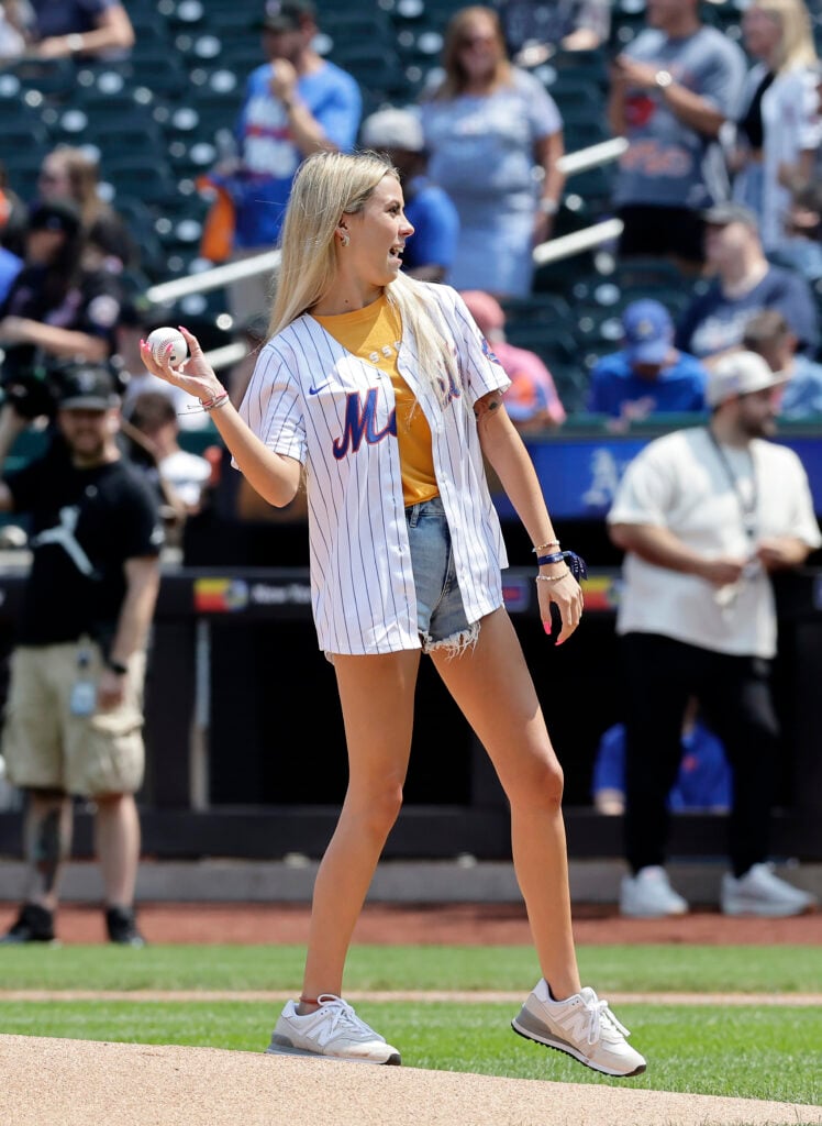 Viral internet personality Haliey Welch throws the ceremonial first pitch of a game between the New York Mets and the Oakland Athletics at Citi Field on August 15, 2024 in New York City. 