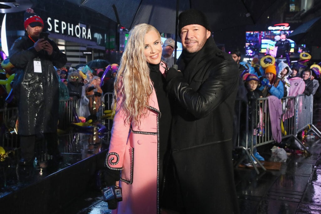 Jenny McCarthy and Donnie Wahlberg pose during Dick Clark's New Year's Rockin' Eve With Ryan Seacrest 2019 on December 31, 2018 in New York City.