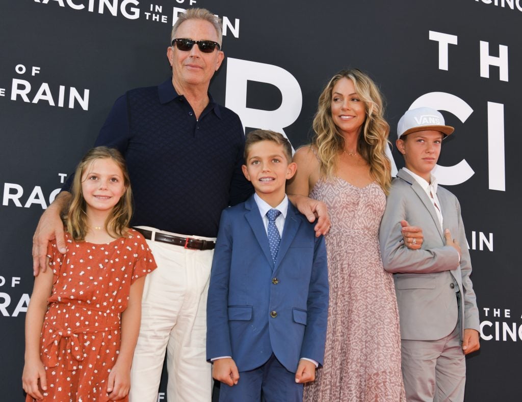 Grace Avery Costner, Kevin Costner, Hayes Logan Costner, Christine Baumgartner, and Cayden Wyatt Costner attend the premiere of 20th Century Fox's "The Art of Racing in the Rain" at El Capitan Theatre on August 01, 2019 in Los Angeles, California.