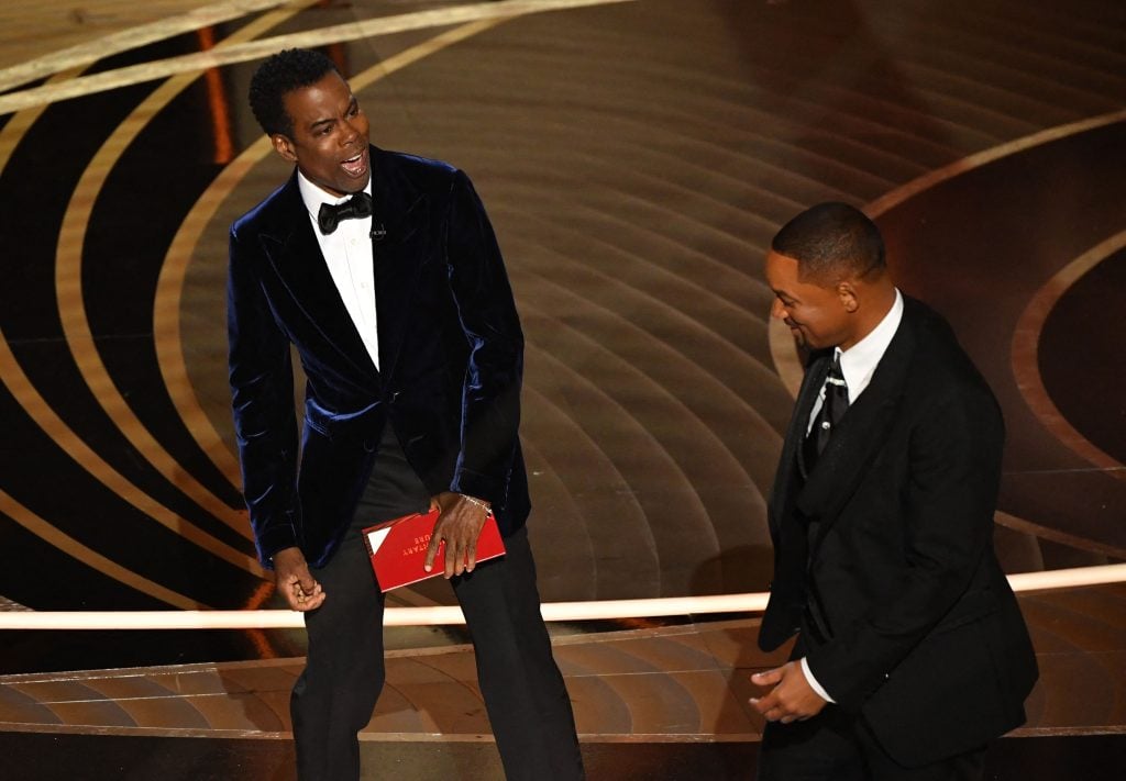 Will Smith approaches Chris Rock onstage during the 94th Oscars at the Dolby Theatre in Hollywood, California on March 27, 2022.
