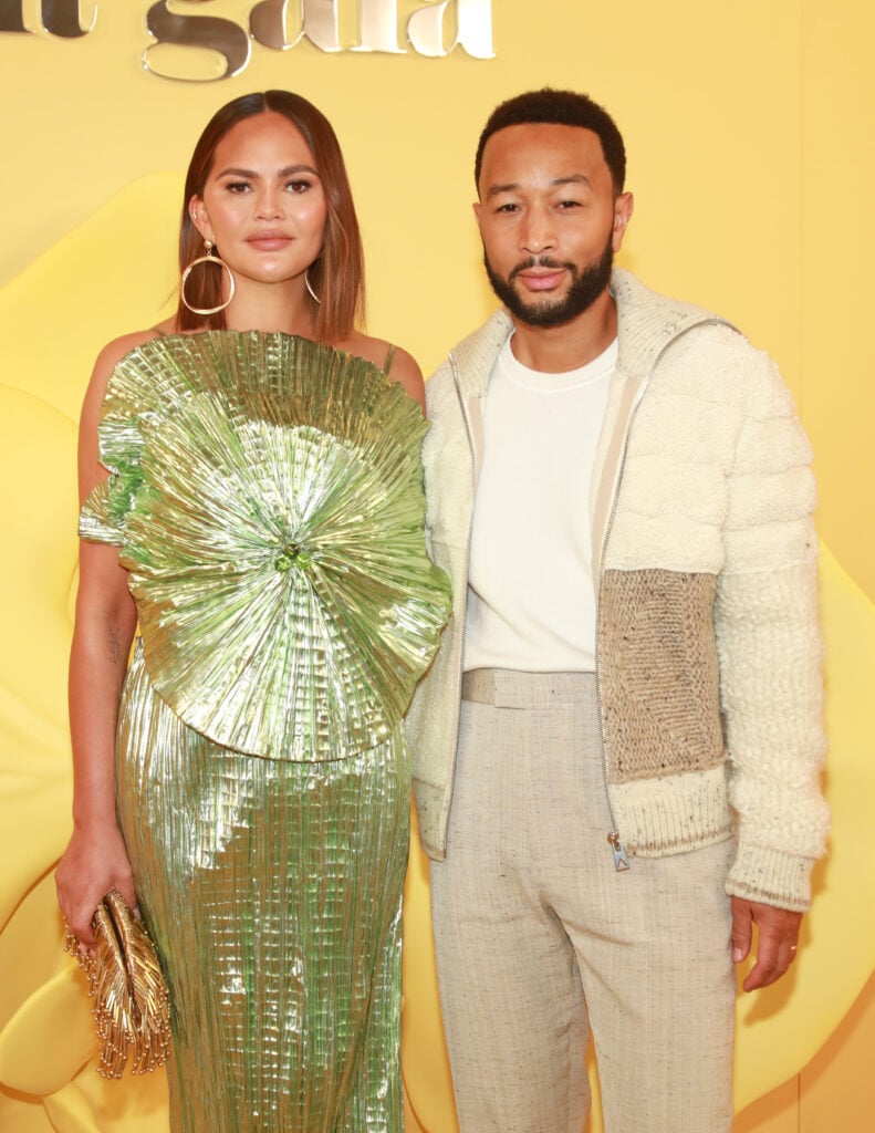 Chrissy Teigen and John Legend attend the Cult Gaia RE24 Runway Show on November 14, 2023 in Los Angeles, California.