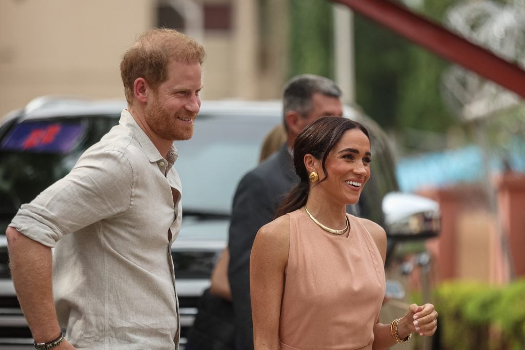 Britain's Prince Harry, Duke of Sussex, and Britain's Meghan, Duchess of Sussex, arrive at the Lightway Academy in Abuja on May 10, 2024 as they visit Nigeria as part of celebrations of Invictus Games anniversary.