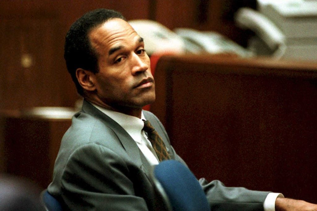 O. J. Simpson sits in Superior Court in Los Angeles 08 December 1994 during an open court session where Judge Lance Ito denied a media attorney's request to open court transcripts from a 07 December private meeting involving prospective jurors.