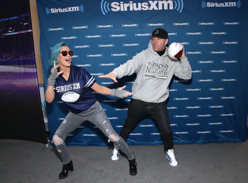 Jenny McCarthy and Donnie Wahlberg visit SiriusXM at Super Bowl LII Radio Row at the Mall of America on February 2, 2018 in Bloomington, Minnesota.
