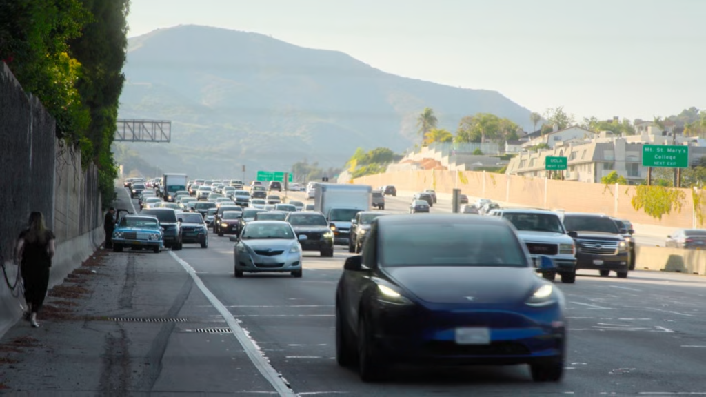 Travis Barker's Chevy Impala stops in the emergency lane amidst LA traffic.
