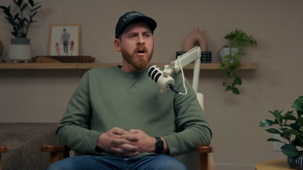 Austin Forsyth clasps his hands on a podcast in February 2025.