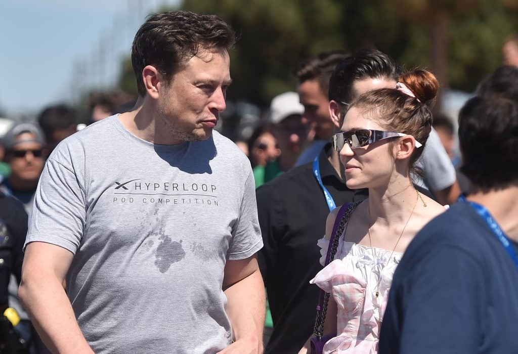 SpaxeX founder Elon Musk and Canadian musician Grimes attend the 2018 Space X Hyperloop Pod Competition, in Hawthorne, California on July 22, 2018.