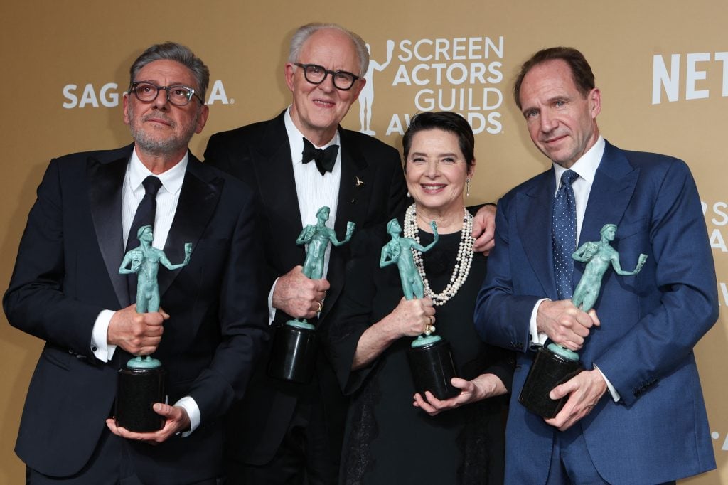 The cast of "Conclave" actors Ralph Fiennes, Isabella Rossellini, Sergio Castellitto and John Lithgow pose in the press room with the award for Outstanding Performance by a Cast in a Motion Picture during the 31st Annual Screen Actors Guild awards at the Shrine Auditorium in Los Angeles, February 23, 2025.