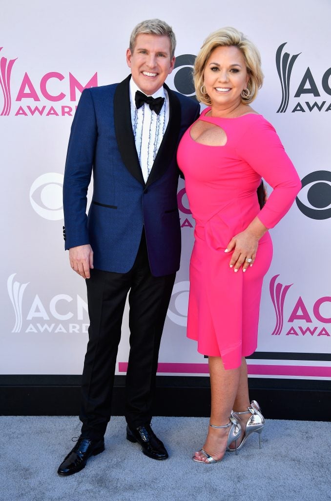 TV personalities Todd Chrisley and Julie Chrisley attend the 52nd Academy Of Country Music Awards at Toshiba Plaza on April 2, 2017 in Las Vegas, Nevada.