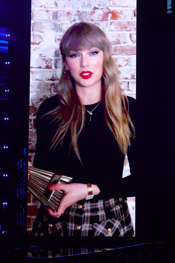 Taylor Swift with a snake necklace during the iHeartRadio Music Awards.