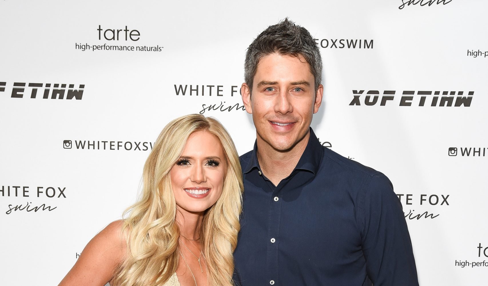 Lauren Burnham and Arie Luyendyk attend White Fox Boutique Swimwear Launch Of 100% Salty at Catch on July 26, 2018 in West Hollywood, California.