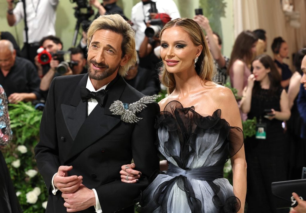 Adrien Brody and Georgina Chapman attend the 2024 Met Gala Celebrating "Sleeping Beauties: Reawakening Fashion" at The Metropolitan Museum of Art on May 06, 2024 in New York City.