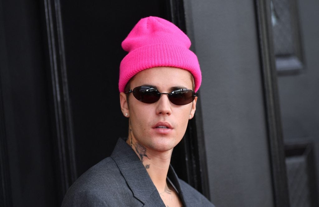 Justin Bieber in April of 2022, wearing a pink beanie.