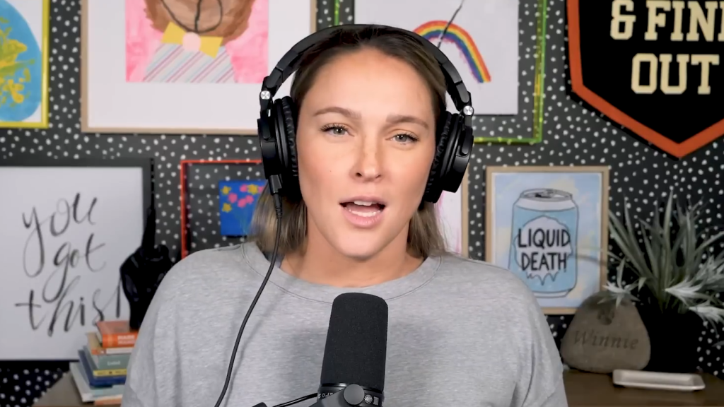 Kylie Kelce in headphones on her Not Gonna Lie podcast in March 2025.