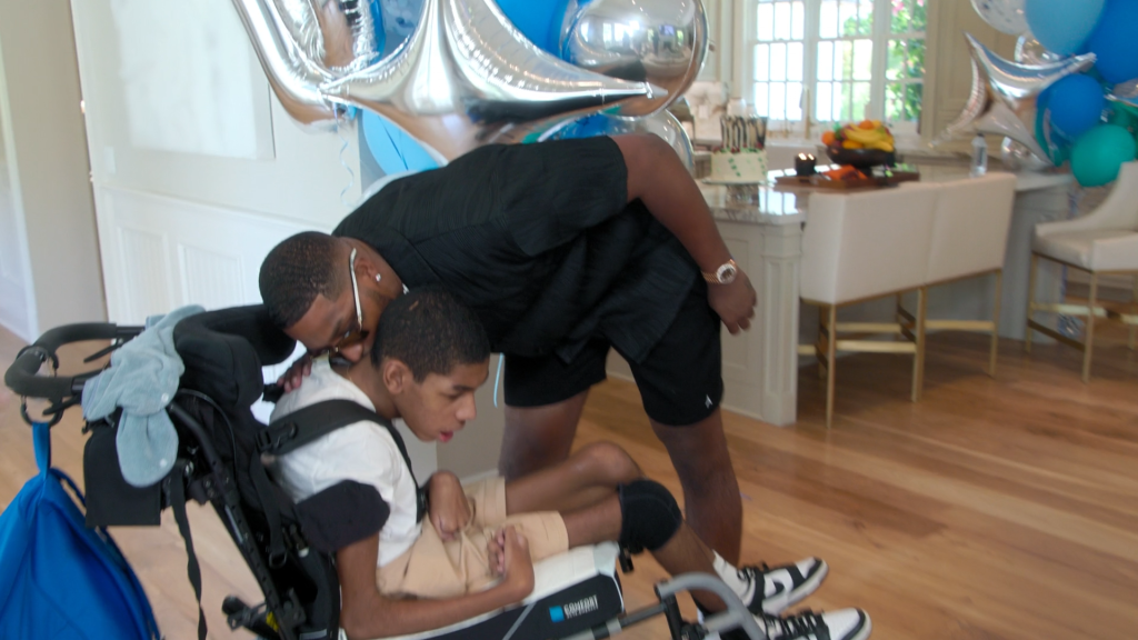 A screenshot from 'The Kardashians' Season 6, Episode 9 in which Tristan Thompson gives a kiss to brother Amari Thompson.