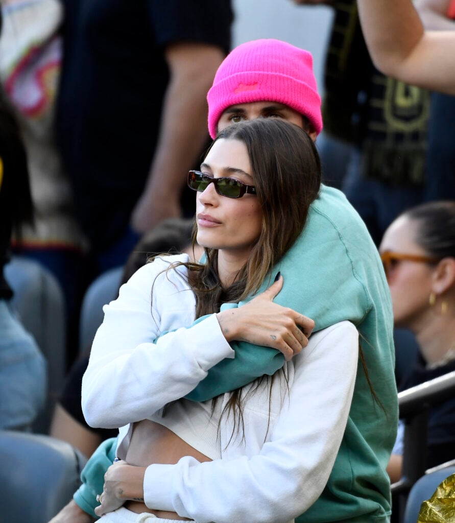 Justin Bieber and Hailey Bieber cuddle in public in 2022.