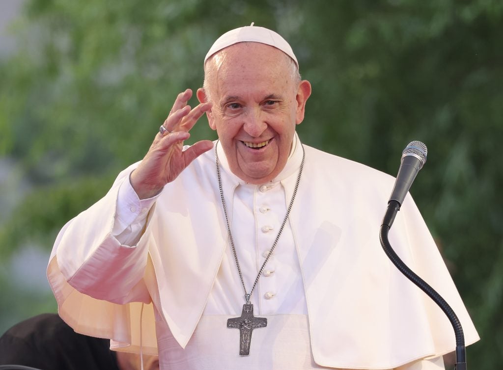 Pope Francis waves to onlookers and pilgrims while visiting the predominantly-Roma Lunik IX city district during his visit to eastern Slovakia on September 14, 2021 in Kosice, Slovakia.