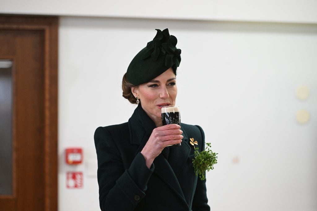 Catherine, Princess of Wales in her role as Colonel, Irish Guards, takes a sip of Guinness during a visit to the 2025 Irish Guards' St. Patrick's Day Parade at Wellington Barracks on March 17, 2025 in London, England.