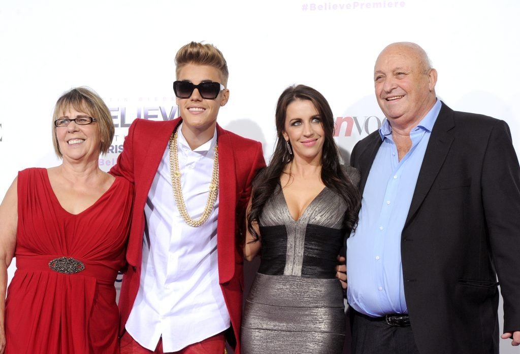 Diane Dale, singer/producer Justin Bieber, Pattie Mallette and Bruce Dale arrive at the premiere Of Open Road Films' "Justin Bieber's Believe" at Regal Cinemas L.A. Live on December 18, 2013 in Los Angeles, California.