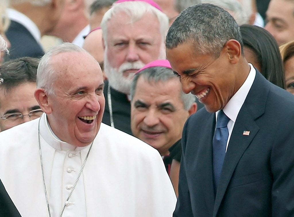 Pope Francis is escorted by U.S. President Barack Obama as he greets and other political and Catholic church leaders after arriving from Cuba September 22, 2015 at Joint Base Andrews, Maryland.