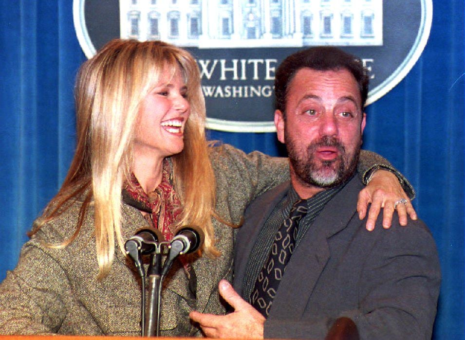 Billy Joel and his wife, Christie Brinkley, pose for photographers during a visit to the White House 19 October 1993.