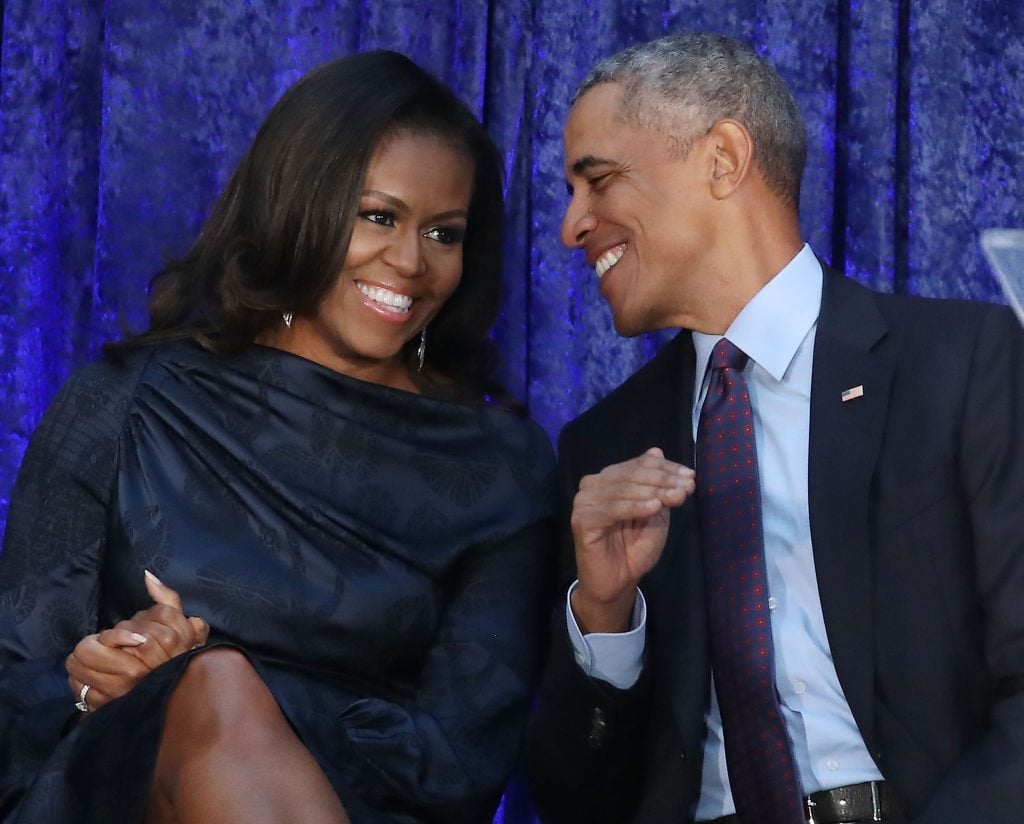 Former U.S. President Barack Obama and first lady Michelle Obama participate in the unveiling of their official portraits during a ceremony at the Smithsonian's National Portrait Gallery, on February 12, 2018 in Washington, DC.