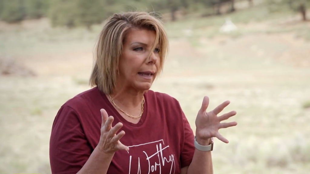 Meri Brown gestures outdoors on Sister Wives.