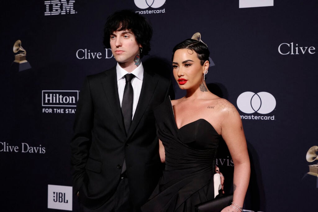 Demi Lovato and Jordan Lutes, whom fans know as Jutes, pose in formal wear.