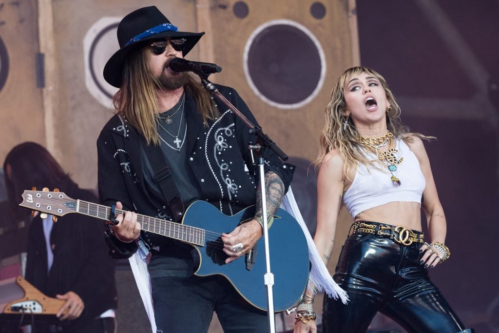 Billy Ray Cyrus and Miley Cyrus perform on the Pyramid stage on day five of Glastonbury Festival at Worthy Farm, Pilton on June 30, 2019 in Glastonbury, England.