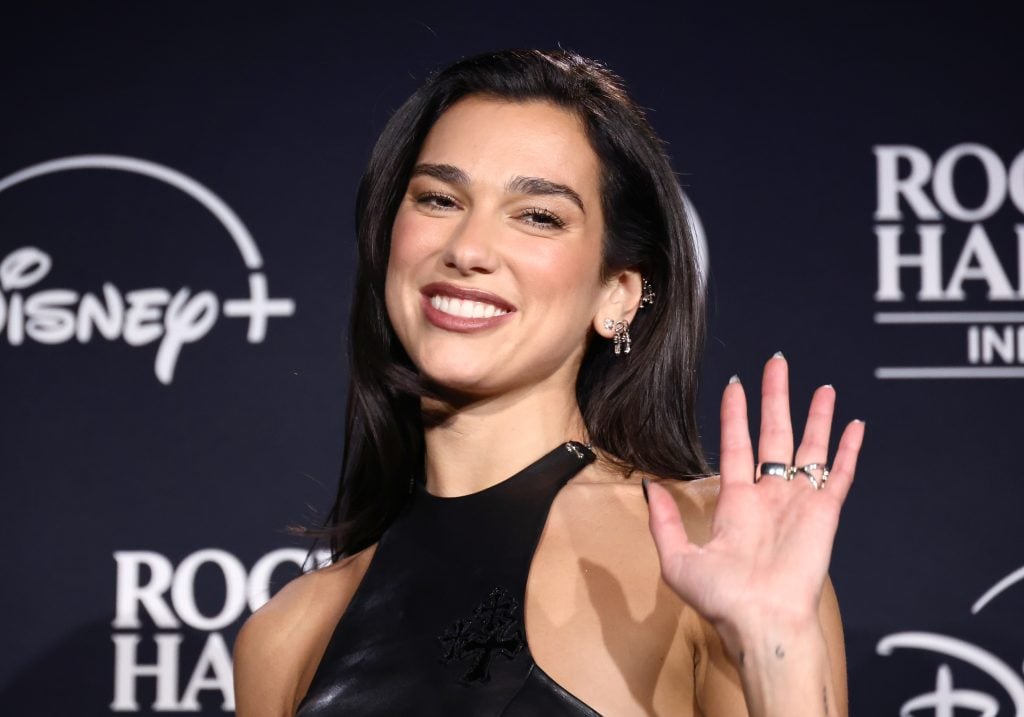 Dua Lipa on October 19, 2024 with rings on her fingers.