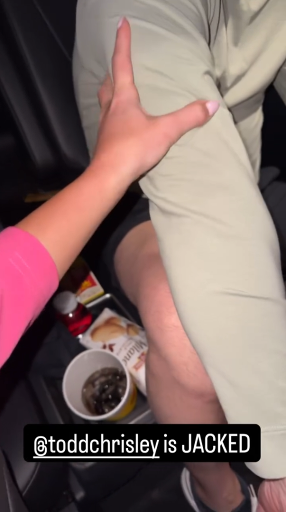 Savannah Chrisley's hand grasps the arm of Todd Chrisley while the caption announces that he is "jacked."