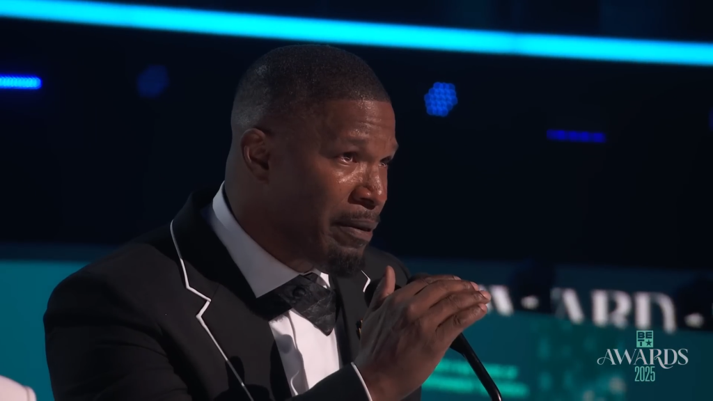 Jamie Foxx speaks on stage at the 2025 BET Awards.