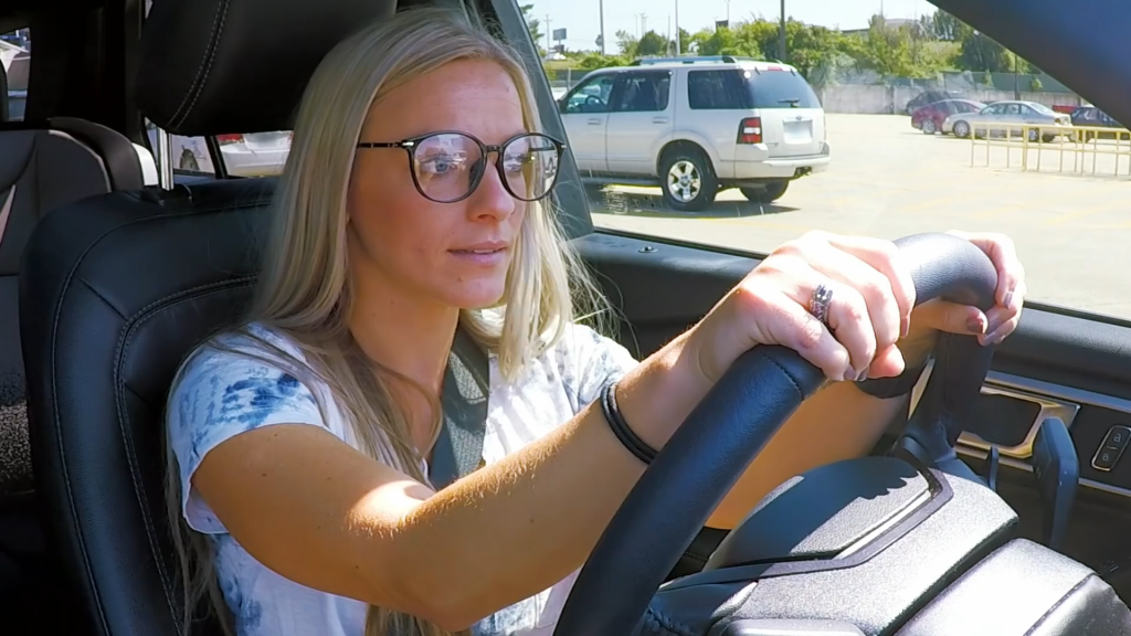 Mackenzie McKee wears glasses and drives.