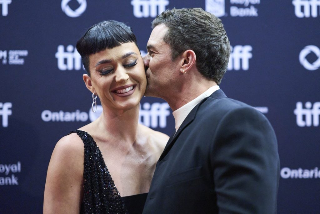 English actor Orlando Bloom and his partner US singer Katy Perry arrive for the premiere of "The Cut" during the Toronto International Film Festival at the Princess of Wales Theatre in Toronto, Ontario, Canada, on September 5, 2024.