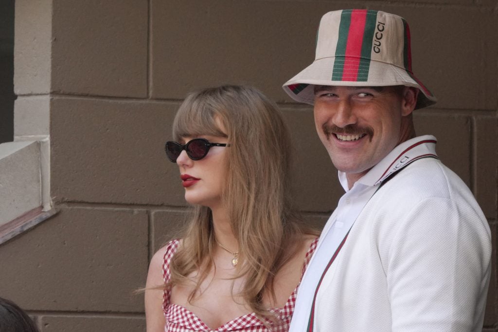 US musician Taylor Swift and US NFL football player Travis Kelce attend the men's final match between Italy's Jannik Sinner and USA's Taylor Fritz on day fourteen of the US Open tennis tournament at the USTA Billie Jean King National Tennis Center in New York City, on September 8, 2024.