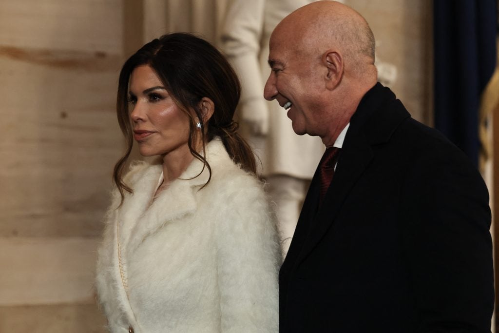 Founder of Amazon and Blue Origin Jeff Bezos and his fiance Lauren Sanchez depart inauguration ceremonies in the Rotunda of the US Capitol on January 20, 2025 in Washington, DC.