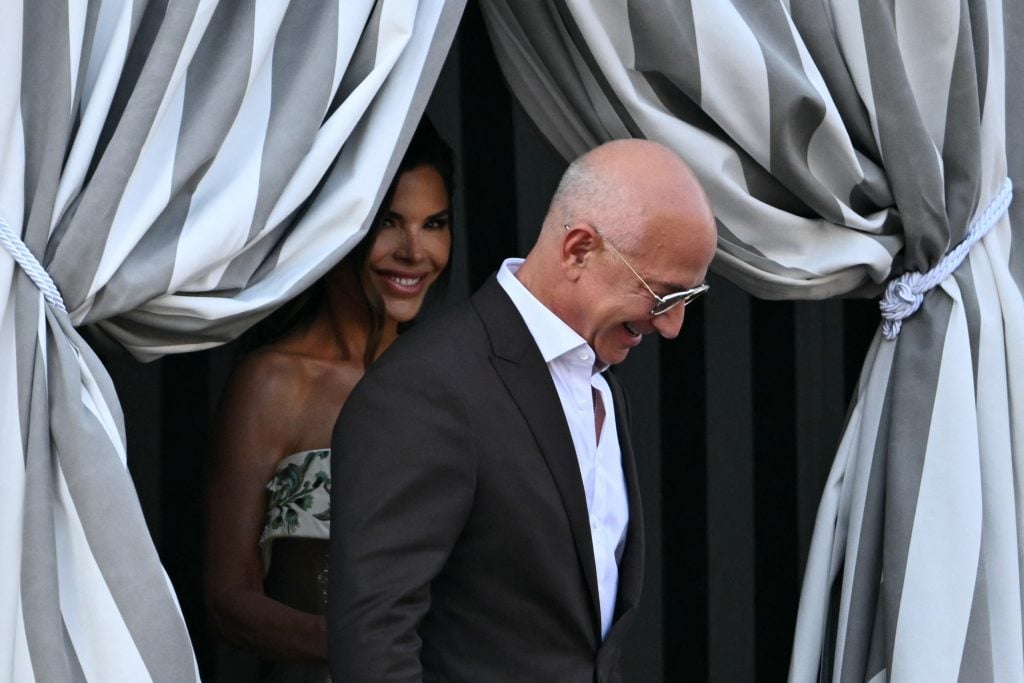 Amazon founder Jeff Bezos and Lauren Sanchez get on a taxi boat at the Aman Hotel in Venice on June 26, 2025. 