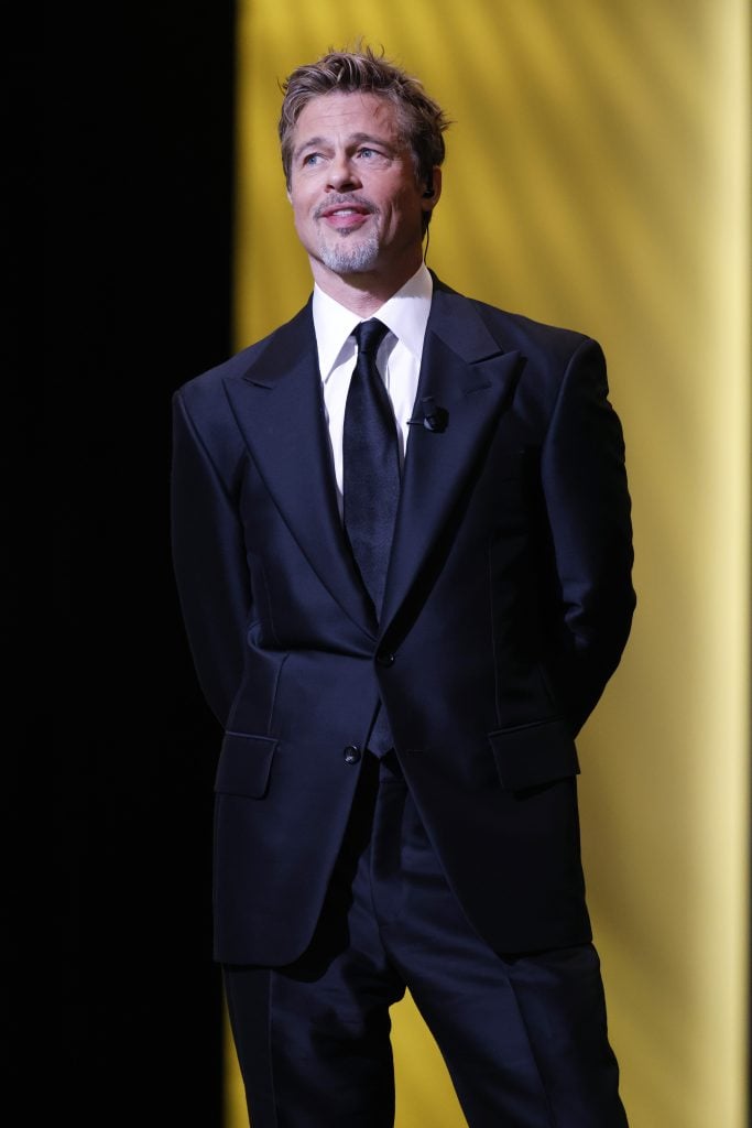 Brad Pitt onstage while David Fincher receives the "Honorary César Award" during the 48th Cesar Film Awards at L'Olympia on February 24, 2023 in Paris, France.